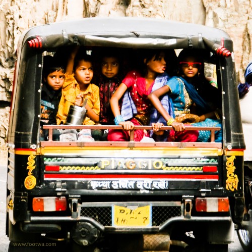 Kids on their way to school in an auto